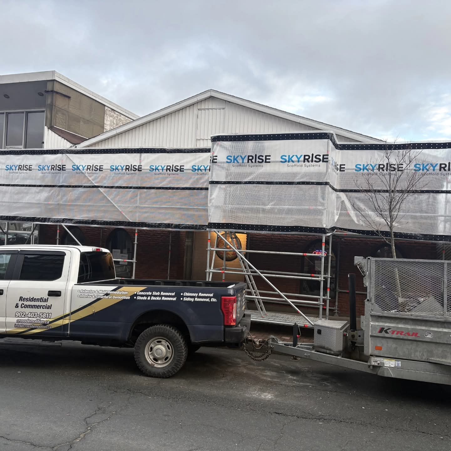 Cross Brothers truck and trailer on site at May Garden Restaurant demolition